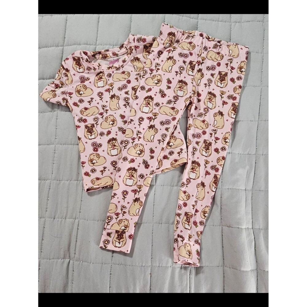 Penelope Mack,  pink capybaras and floral Pjs
